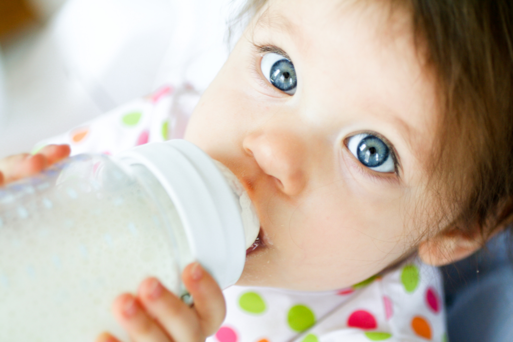 Baby Drinking Milk On Bottle